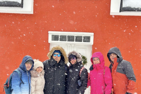 Tourists posing in Rovaniemi while snowing, traveled with finlandtour.fi, part of the 8 days Finland tour package